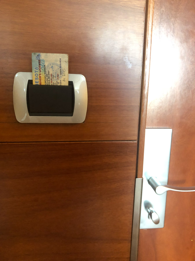 All of the power in your room is dependent upon your room key being in this slot.  You remove the key when you leave, everything shuts off.  SInce we were charging devices 'n' such, we cheated by leaving my driver's license in there.   Sorry, Gaia.  I needed my batteries charged!