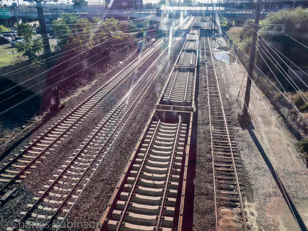 I love the look of the rail ties in the cars while on the tracks.  Shot through sunlit plexiglass, unfortunately.<br />October 10, 2016@16:14