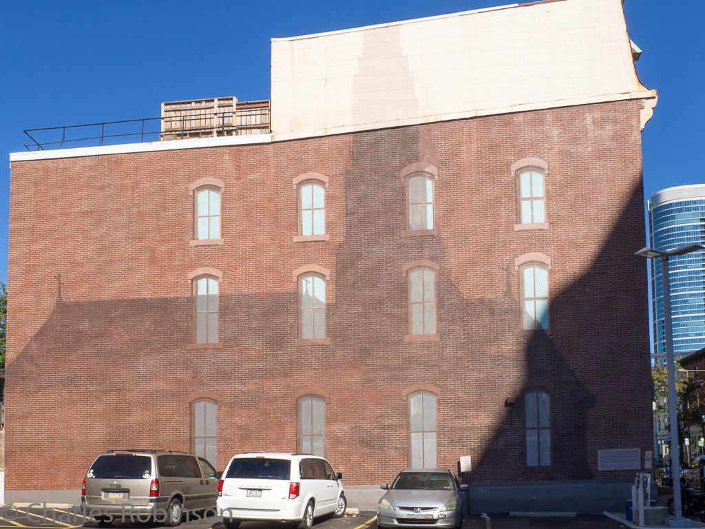 Cool trompe-l'oeil on the side of a building, reflecting what USED to be there (including the shadow of a since-demolished church).<br />October 14, 2016@11:43