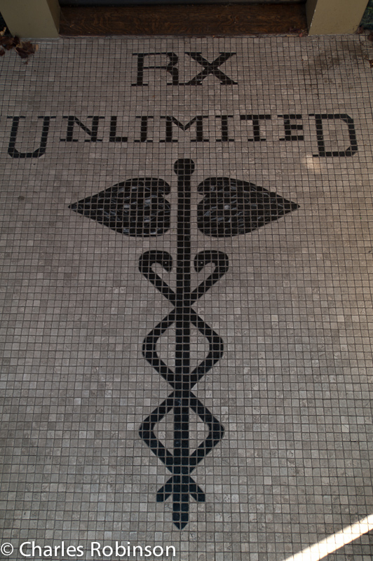 Cool entryway mosaic.  No longer a pharmacy, looked like a private residence now.<br />November 08, 2011@15:49