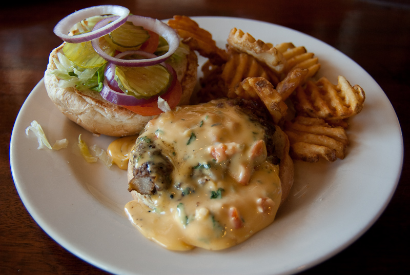 February 17, 2010@14:01<br/>Galveston's idea of a Juicy Lucy - bacon cheeseburger with chile con queso.  YUM.
