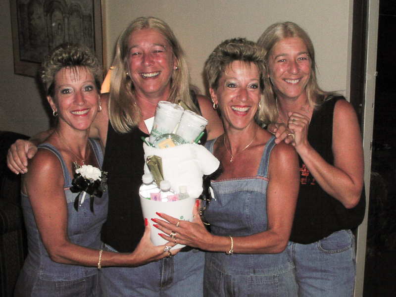 July 31, 2003@18:13<br/>Here, Jean and Jill present Denise and Diane with their impromptu birthday presents - extra drinking cups, ice buckets, clean ashtrays, some sweet-n-low... just the kind of stuff you'll need for an extended stay at the hotel. Way to plan ahead, Jean and Jill! :-)