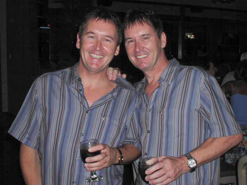 July 31, 2003@23:59<br/>Richard and John made their way over from England to attend their very first Twins Days festival. In another wise move, you can see that they're sticking to the wine at the bar, rather than the American beer! Nice to meet you two...