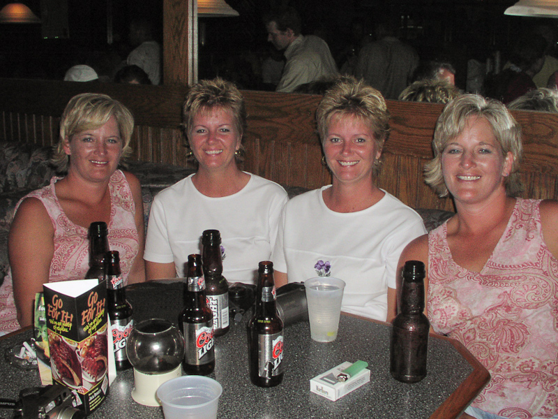 August 02, 2003@21:50<br/>Hangin' out in the bar again (after our naps)... here's DeeAnn, Lorna, Linda, and AnnDee. Sorry I had to ask y'all for your names after the photo, but I can never remember who's who. For those of you watching who are NOT twins, you may be surprised to know that telling two twins apart is not a natural skill that twins are any better at than anyone else... It takes some time to get to know people before you are certain 