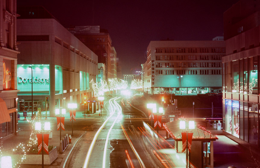 Looking north on Nicollet Mall from the Daytons/IDS Skyway.  Note the hole in the ground where Norwest Bank USED to be.