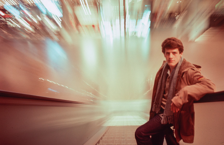 John on the escalators in the Crystal Court