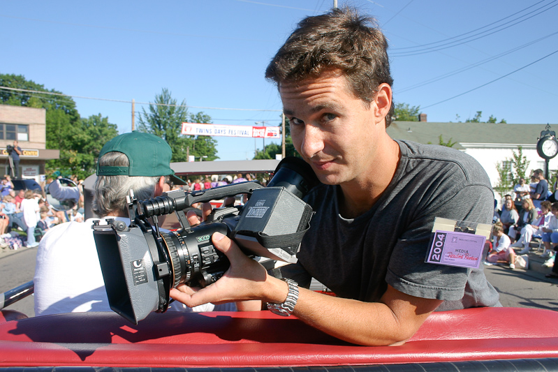 August 07, 2004@09:07<br/>The Reading Rainbow cameraman enjoys the ride on the float