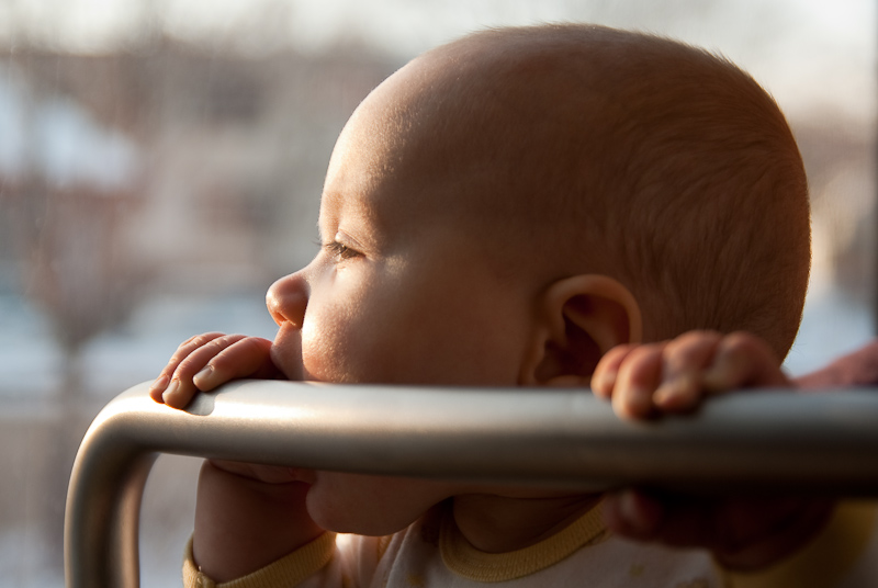 January 10, 2010@15:22<br/>Mmmmmm.... cold railing.  Just the thing for a teething infant.