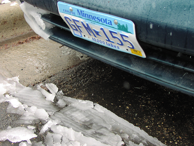 April 21, 2002@12:21<br/>Notice how the snow which has flopped off of the front of the car has a perfect imprint from the license plate?
