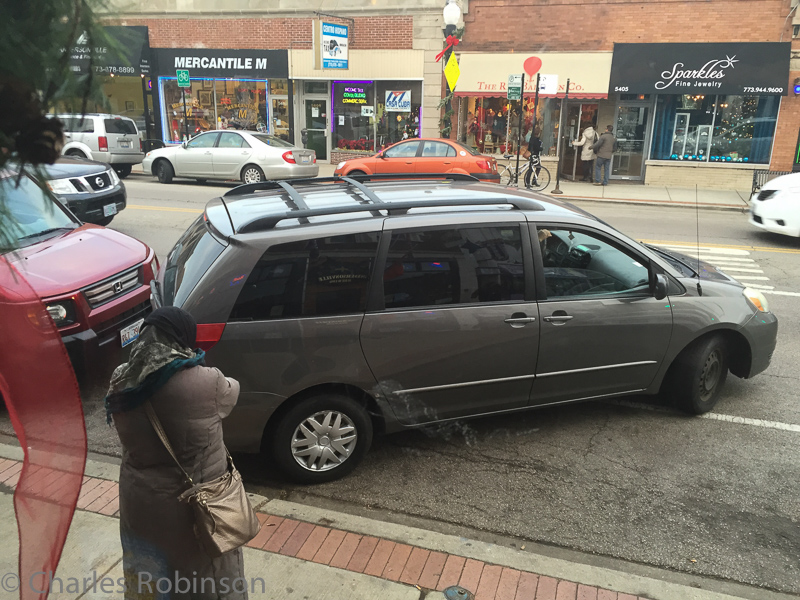 Sitting inside a restaurant, many people amused themselves by watching this person attempt, for about 5 minutes, to parallel-park in this spot.<br />December 13, 2014@15:35