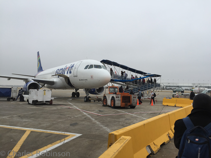 Spirit Airlines does not have enough gates at O'Hare.  We had to board by going outside and up the cheesy metal ramp seen here.  Good thing it wasn't raining!<br />December 14, 2014@08:47