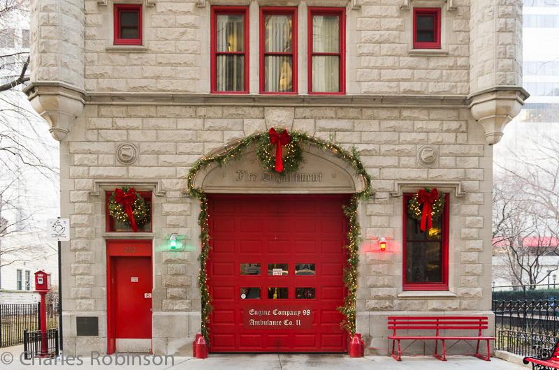 Love the firehouse all decorated for the holidays.  Even though the red and green lights are probably always there, they fit well with the red doors and green garlands.<br />December 11, 2014@14:53