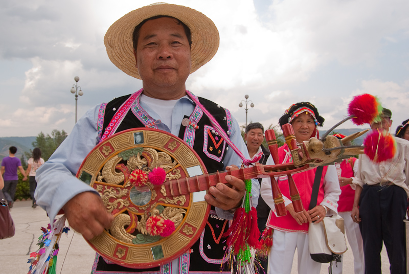 May 01, 2010@16:24<br/>We watched some folk dancers up at the park and I stopped this man to let me photograph his dragon guitar