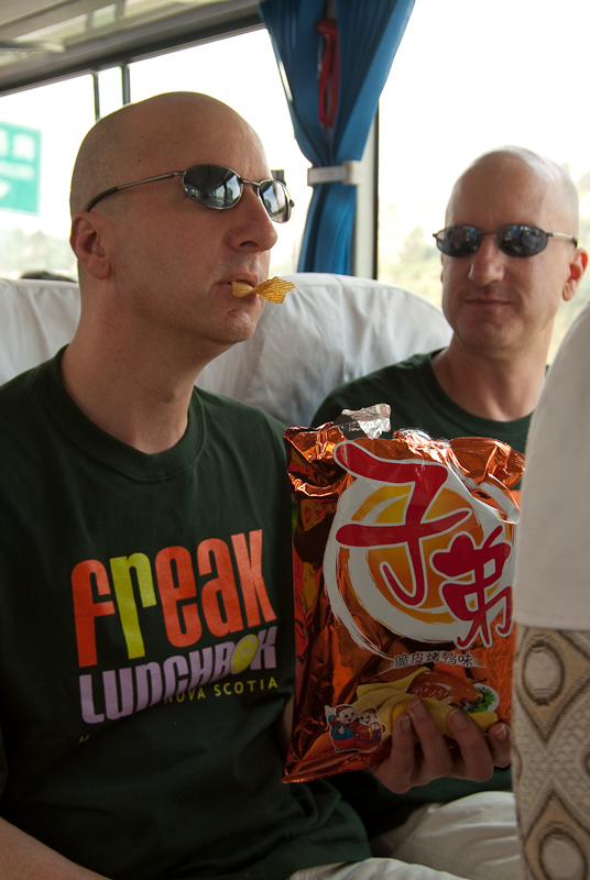 May 03, 2010@10:08<br/>Ross samples his bag of duck-flavored (chicken?) potato chips