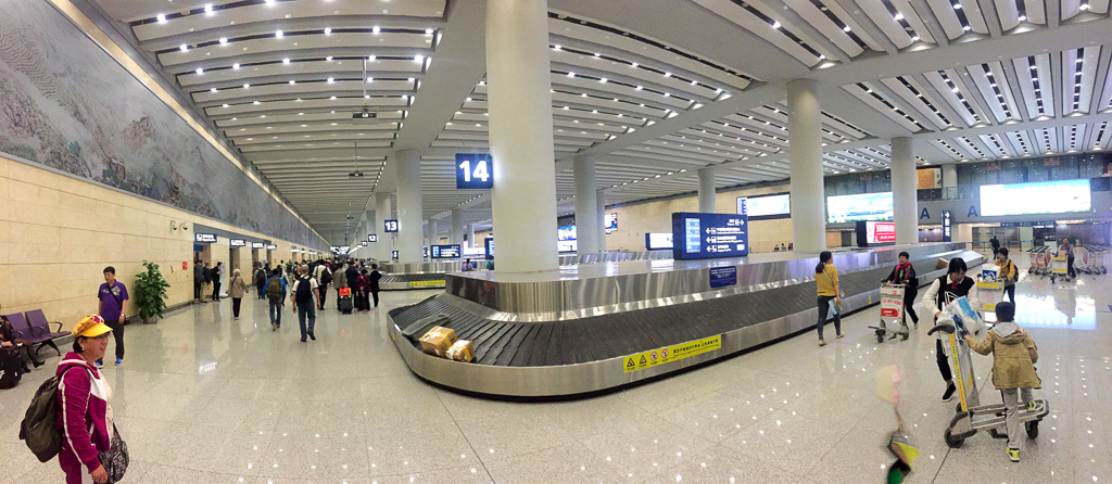 At baggage claim in Kunming.  The new airport is MUCH nicer and fancier than the old one, which was built in the 1920s.<br />April 30, 2015@00:56