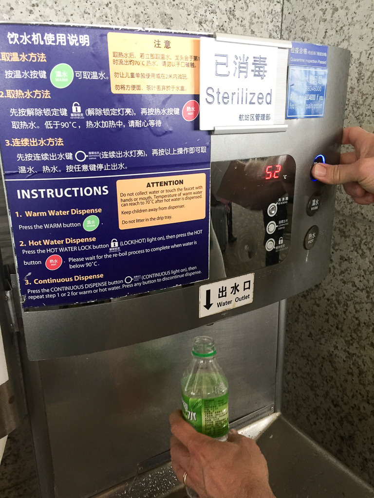 Grabbing some water for our bottles at the airport terminal in Shanghai.  Not that it mattered, since the USA had enhanced security in place, which meant all water and drink bottles were confiscated at the jetway before boarding.  Absolutely fucking stupid.<br />May 04, 2015@14:50