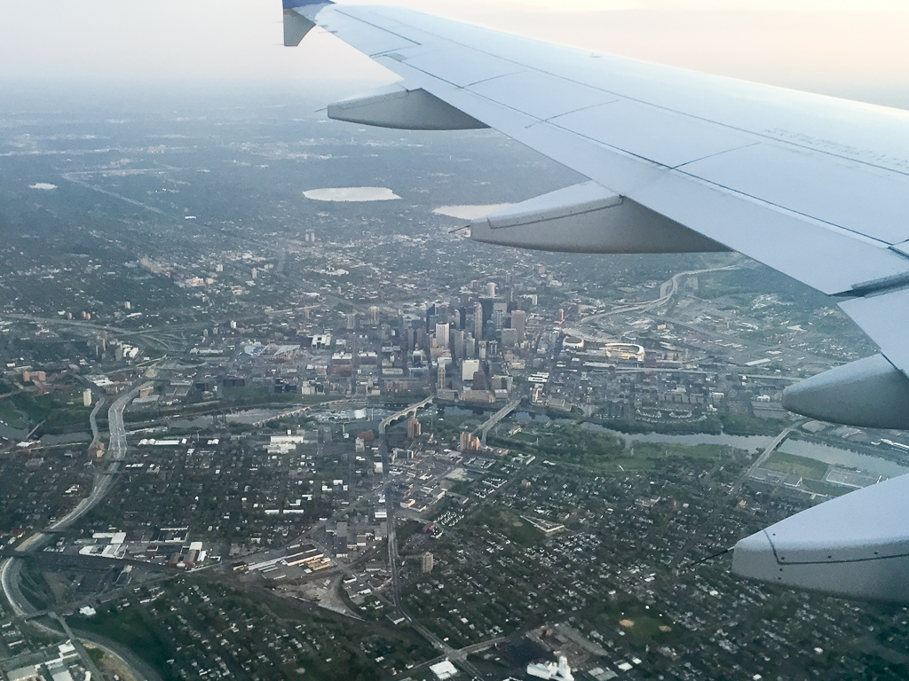 Flying into Minneapolis, we made a loop around downtown.  You can see Target Field all lit up for the Twins game that is currently in-progress.<br />May 04, 2015@20:17