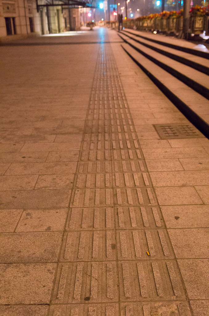 Every sidewalk I saw in China had these same grooves right in the middle.  Couldn't for the life of me figure out what they were for.  Ted Rattei clarified that they are for people who are blind, so they can follow the sidewalk safely using only their feet to tell where they are.  Clever!<br />May 04, 2015@02:15