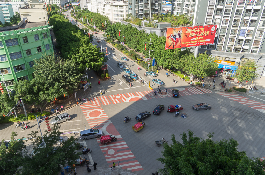 The view from the 7th floor of the Shuang Bao Hotel.  Our room faced out to the back.  Sun Square is up to the left, where the road bends.<br />April 30, 2015@17:07