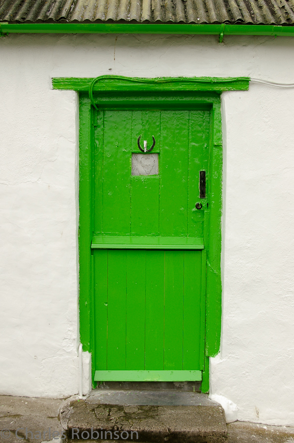 Brightly-painted door which caught my eye.<br />June 16, 2005@12:10