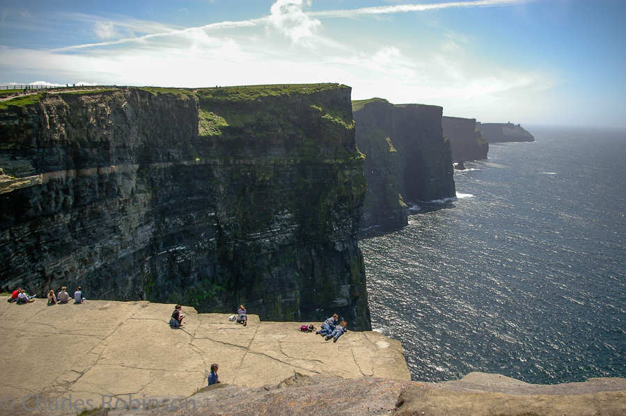 Cliffs of Moher - note all of the people flat on their chests peeking over the drop.<br />June 19, 2005@14:20