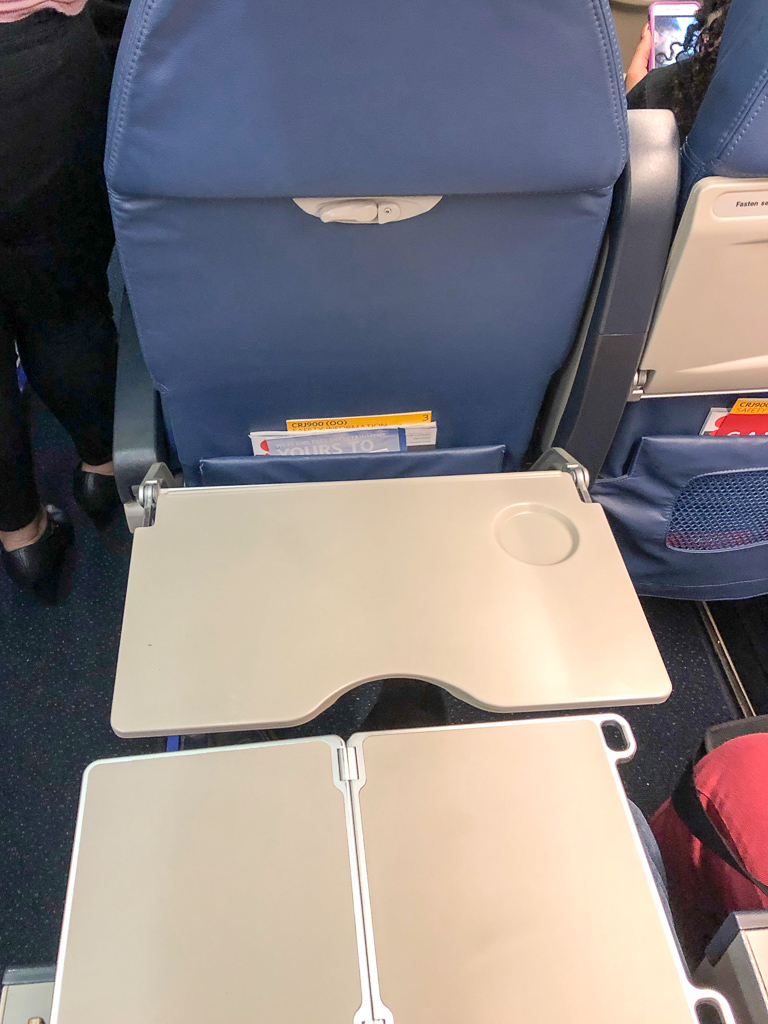 Exit-row seating... we were supposed to only be able to flip up the trays from our armrests, but the locks for the flip-down trays didn't work very well, so: SUPER-TRAY<br />February 01, 2018@20:02