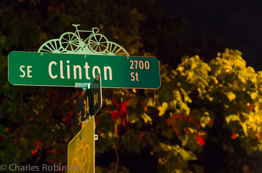 Street signs in Portland usually had some sorta decoration on top.  I like the bike-themed toppers the best.<br />September 29, 2013@22:38
