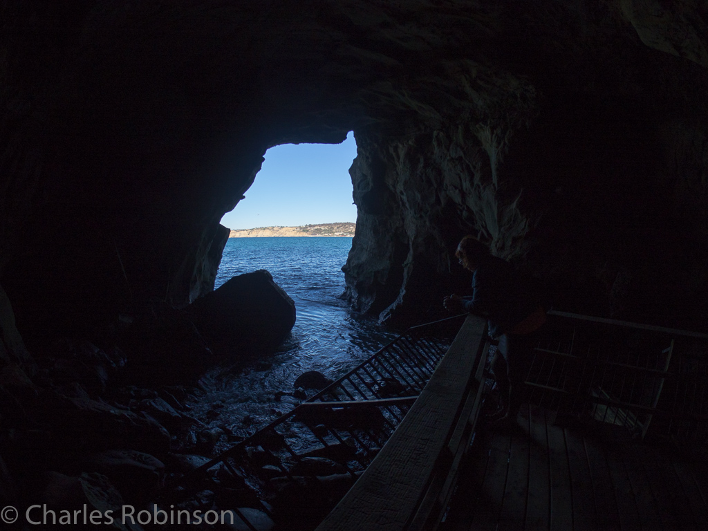 You can take a photograph of the outside, or the inside, of the cave but not really both at the same time.  This is the best compromise I could make.  It was hypnotic watching and hearing the water fill up and then rush out, over and over.<br />December 16, 2015@13:49