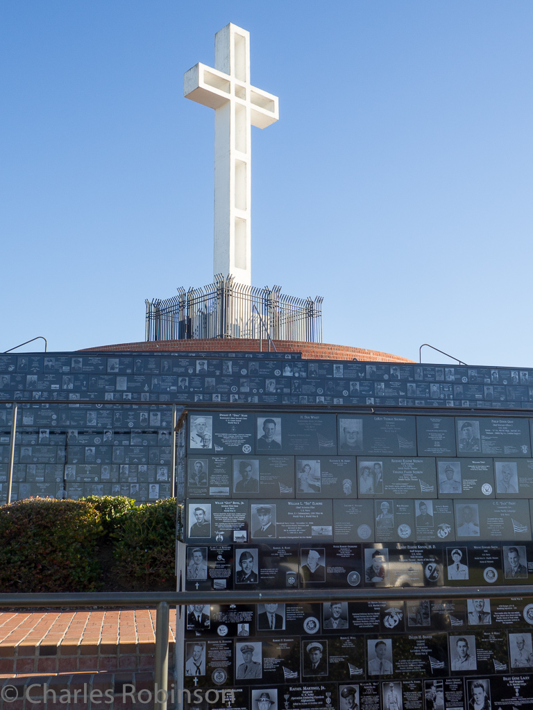 Some of the thousands of plaques arrayed around the walkway up to the cross.<br />December 16, 2015@14:41