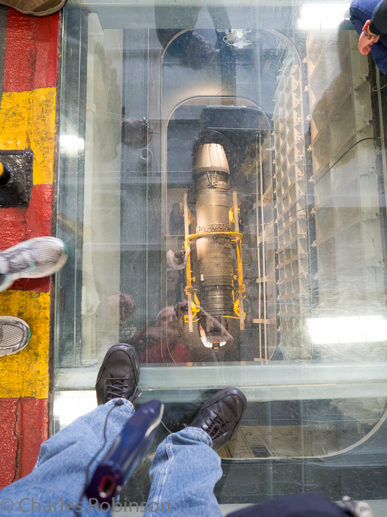 Hanger Deck - looking 5 stories down (of a total of 7?  10? at a jet engine.  This is the elevator for spare parts.<br />December 19, 2015@12:32