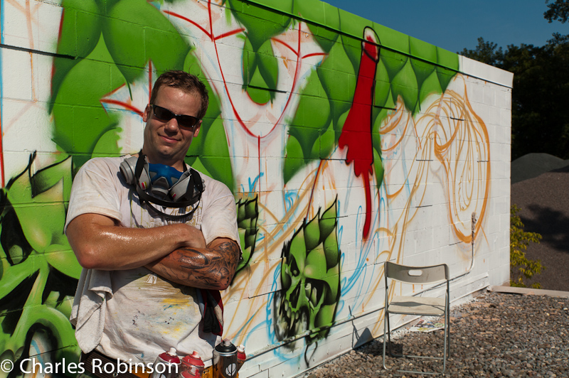 One of the two artists - Adam - poses in front of an unfinished section.<br />September 10, 2011@15:28