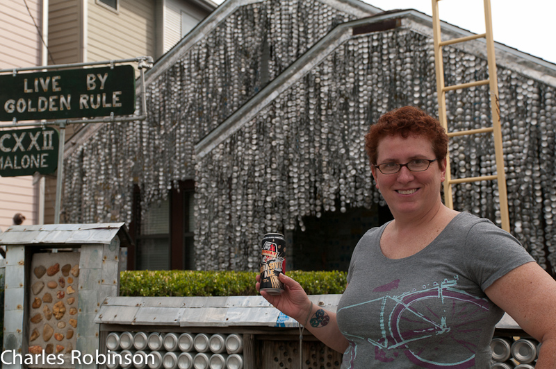 March 04, 2011@10:30<br/>Melissa in front of the beer-can house - with a can of beer.