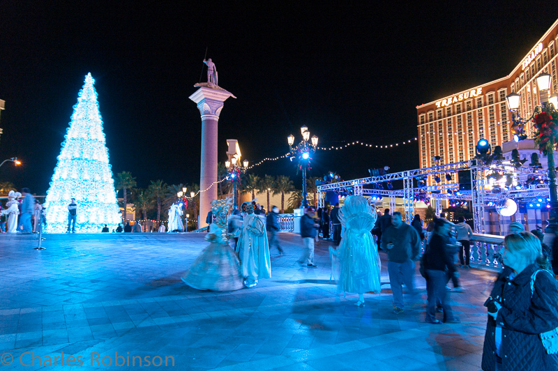 Nighttime on the Vegas Strip.  The Venetian was full of Christmas-related stuff.  Costumed actors, fake ice rink, an LED color-cycling tree...<br />December 11, 2012@19:40
